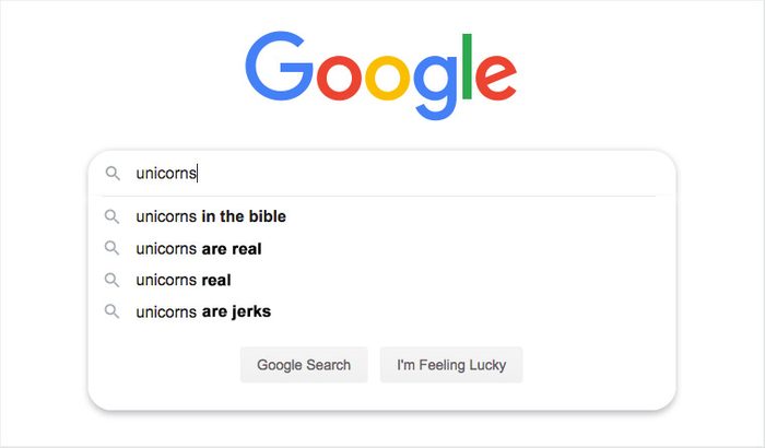 Google search bar displays autocomplete suggestions for "unicorns," including "in the bible," "are real," "real," and "are jerks," on a white background.