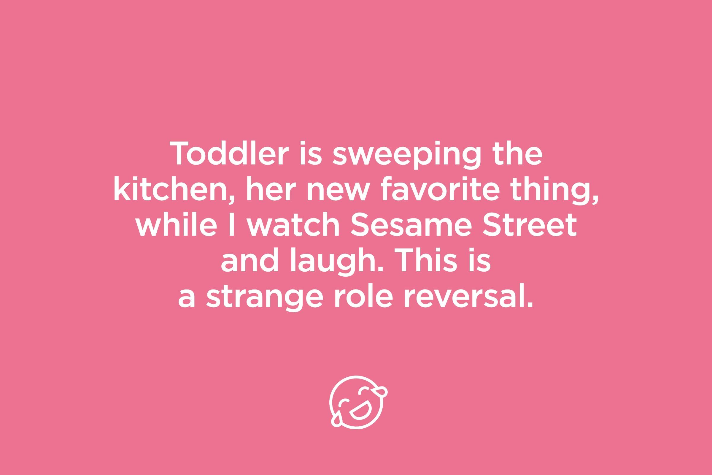 toddler is sweeping the kitchen