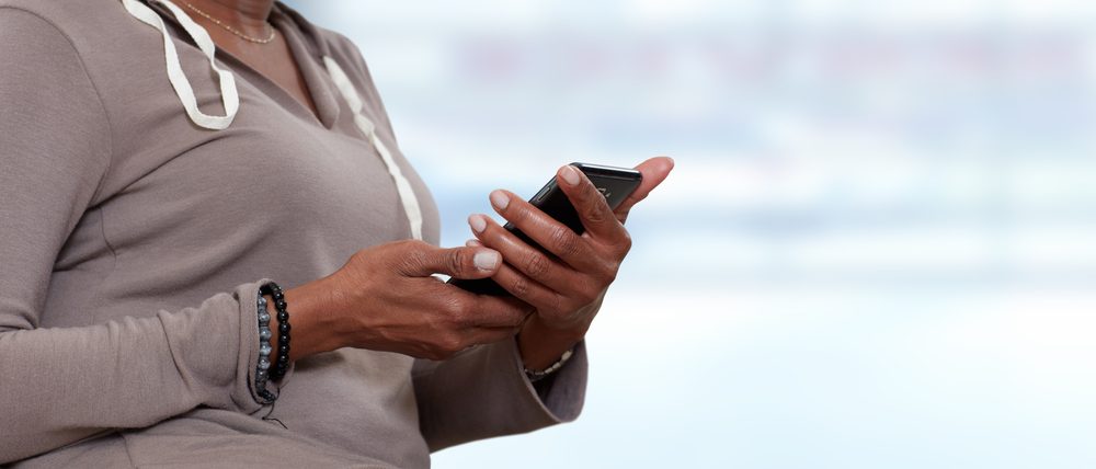 Hands with smartphone.