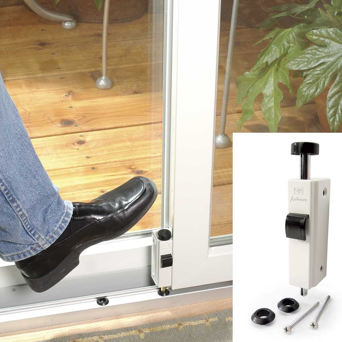 Foot presses sliding door lock on a wooden patio, illustrating the secure latch. Inset shows lock components with text "Andersen."