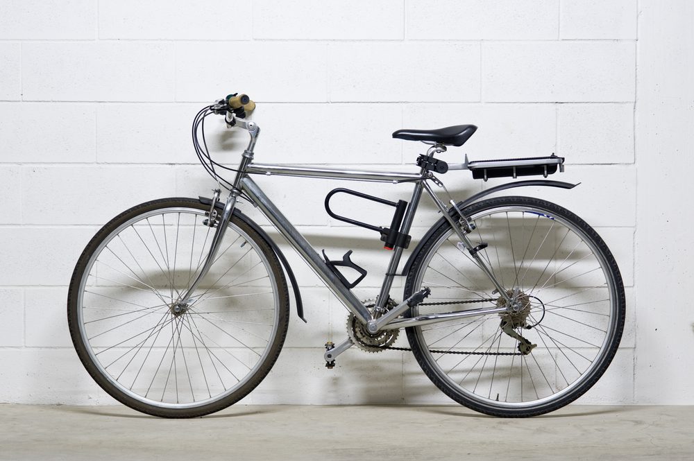 City bike over white wall.