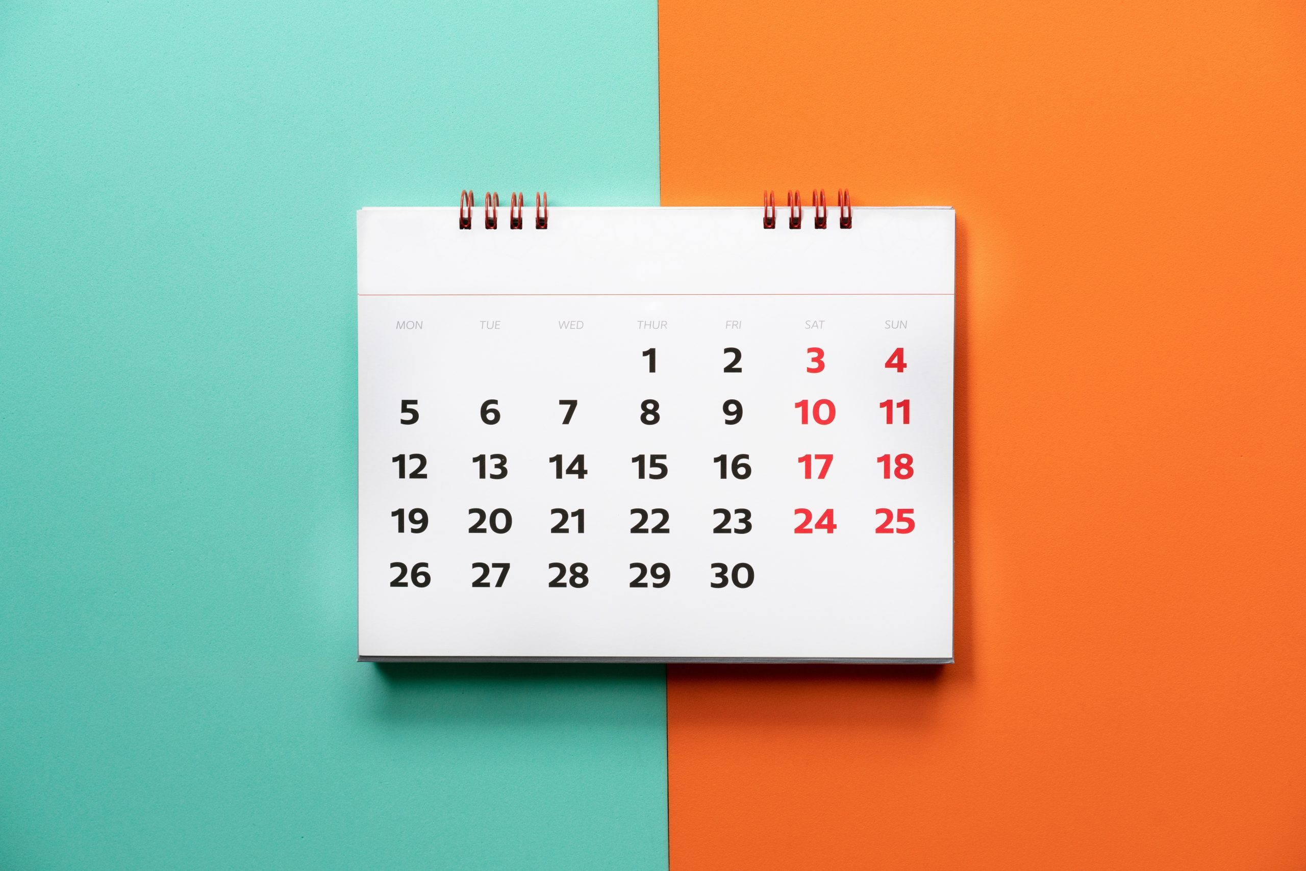 close up of calendar on the color table, planning for business meeting or travel planning concept