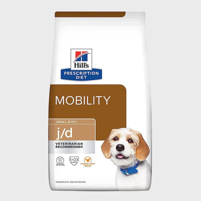 Dog food bag featuring a happy dog in a blue collar, emphasizing mobility support with small bites in a clinical setting.