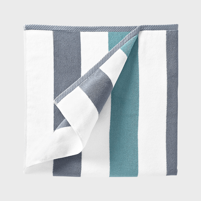 Towel lies flat, showcasing blue, white, and gray stripes, against a plain white background.
