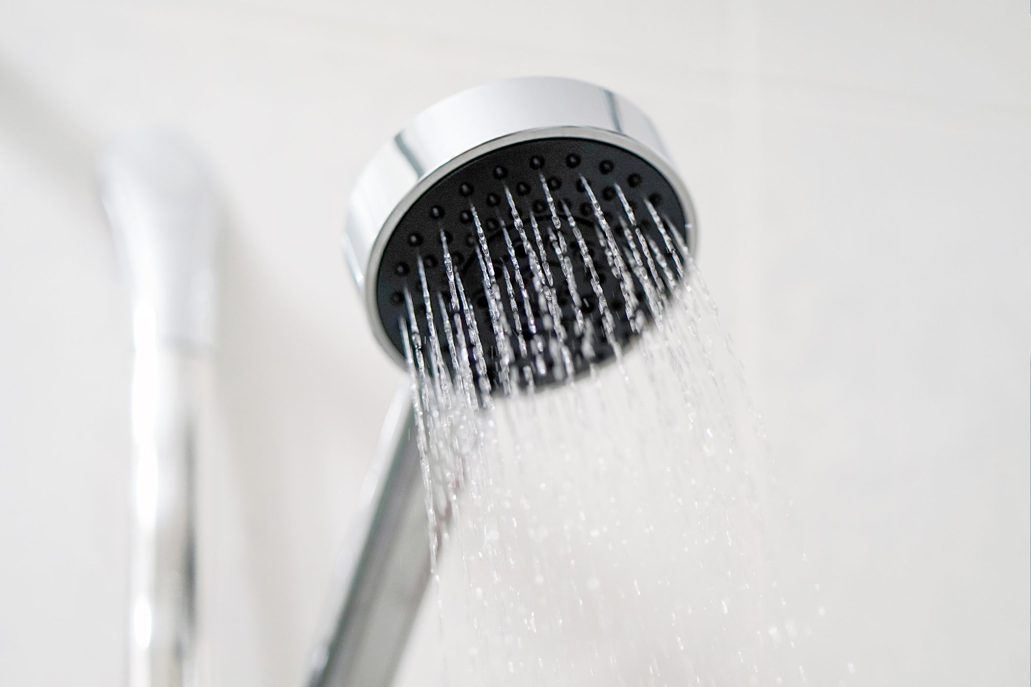 shower head in steamy bathroom 