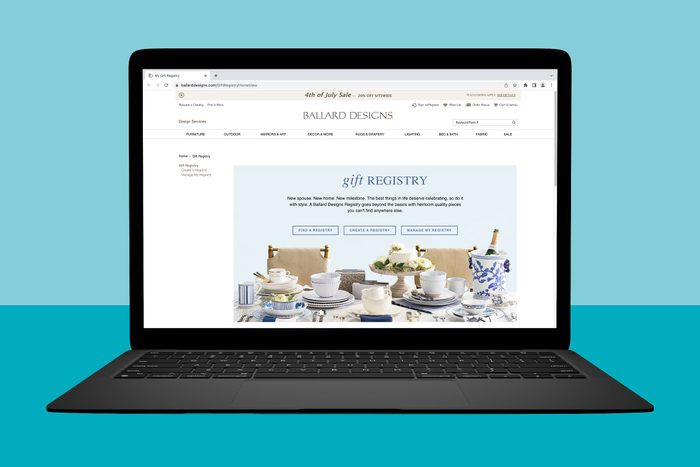 Laptop displaying a gift registry webpage, featuring elegant tableware and a champagne bottle. The background is a solid turquoise color.
