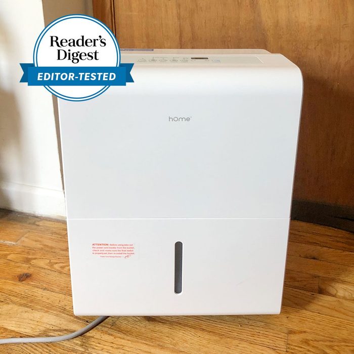 Dehumidifier standing on wooden floor; awarded 