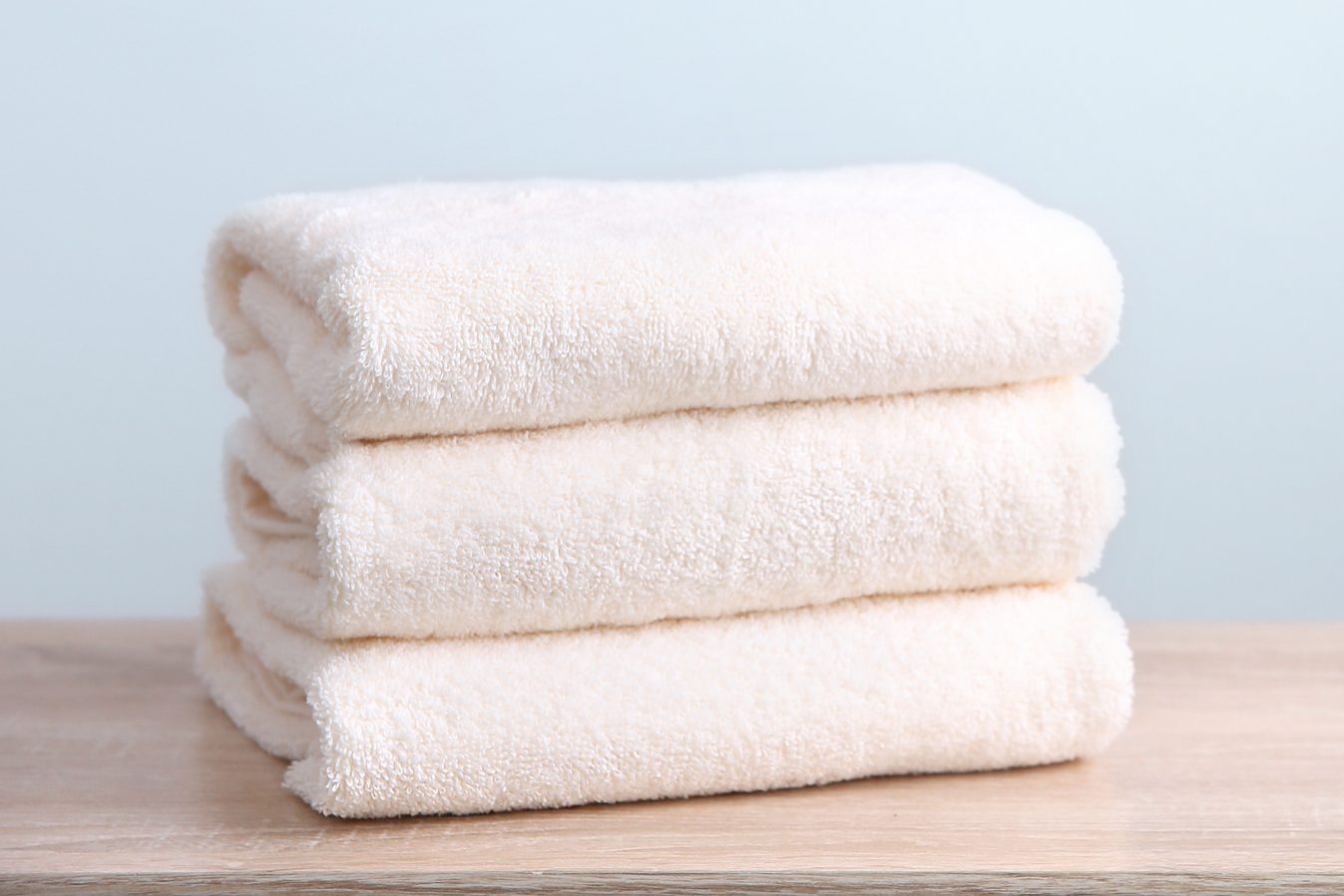 Stack of folded towels empty copy space.