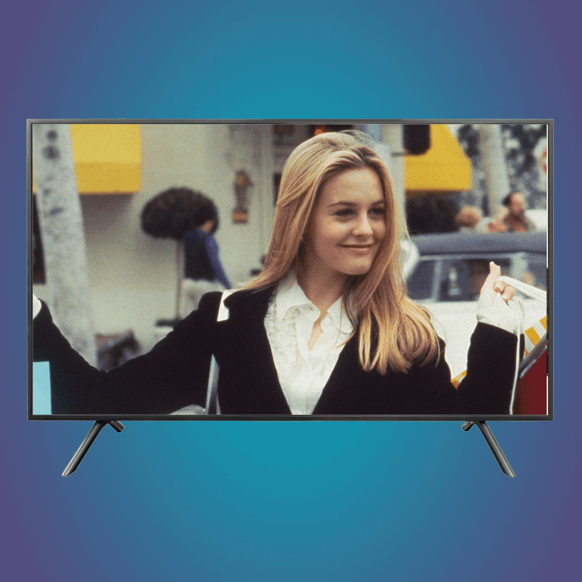 A flat-screen TV displays a woman smiling, arm raised, outdoors beside buildings and trees, with a blurred crowd in the background.