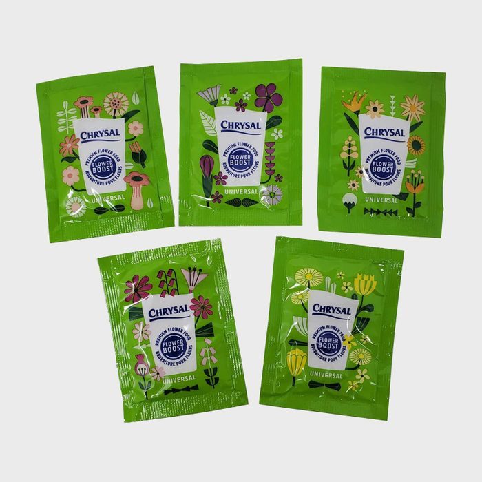 Packets lie arranged in a star formation, featuring floral designs and labeled