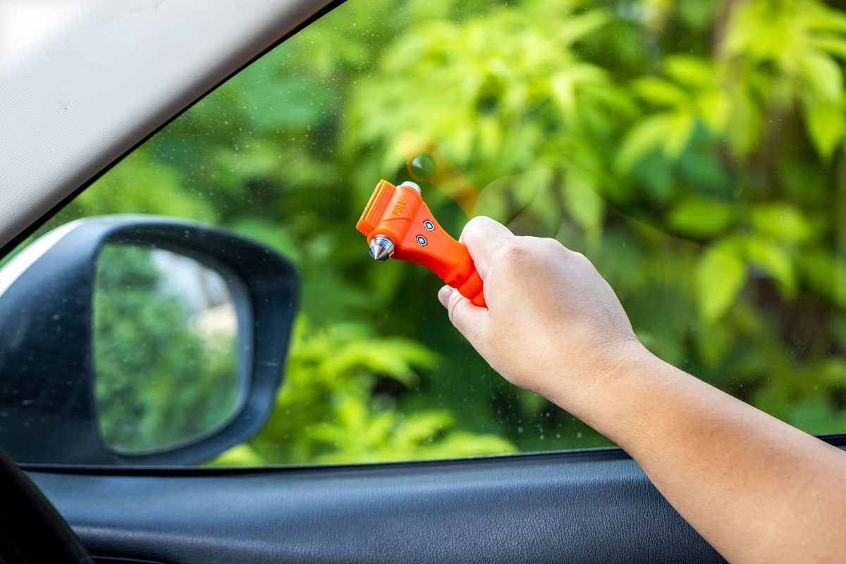 Using Safety Hammer To Break Car Window Glass