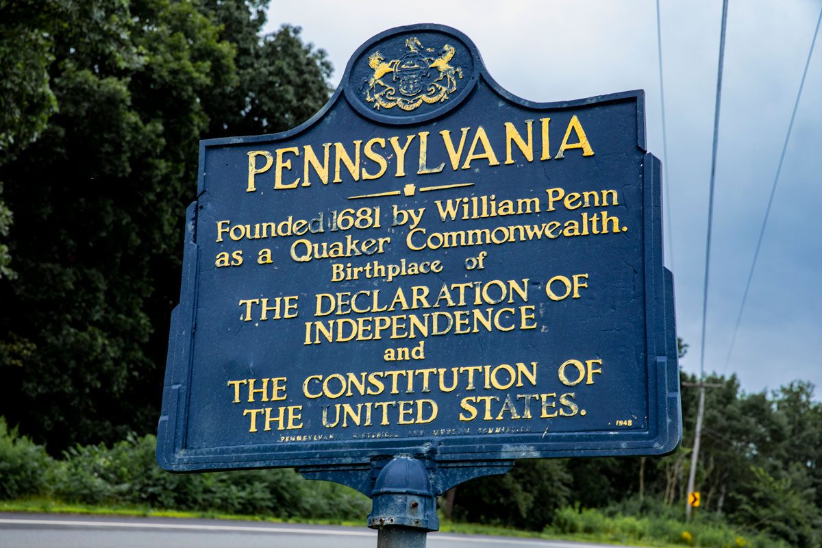 At the state line between Pennsylvania and New York. Sign is along the west side of the road and is blue with gold lettering.
