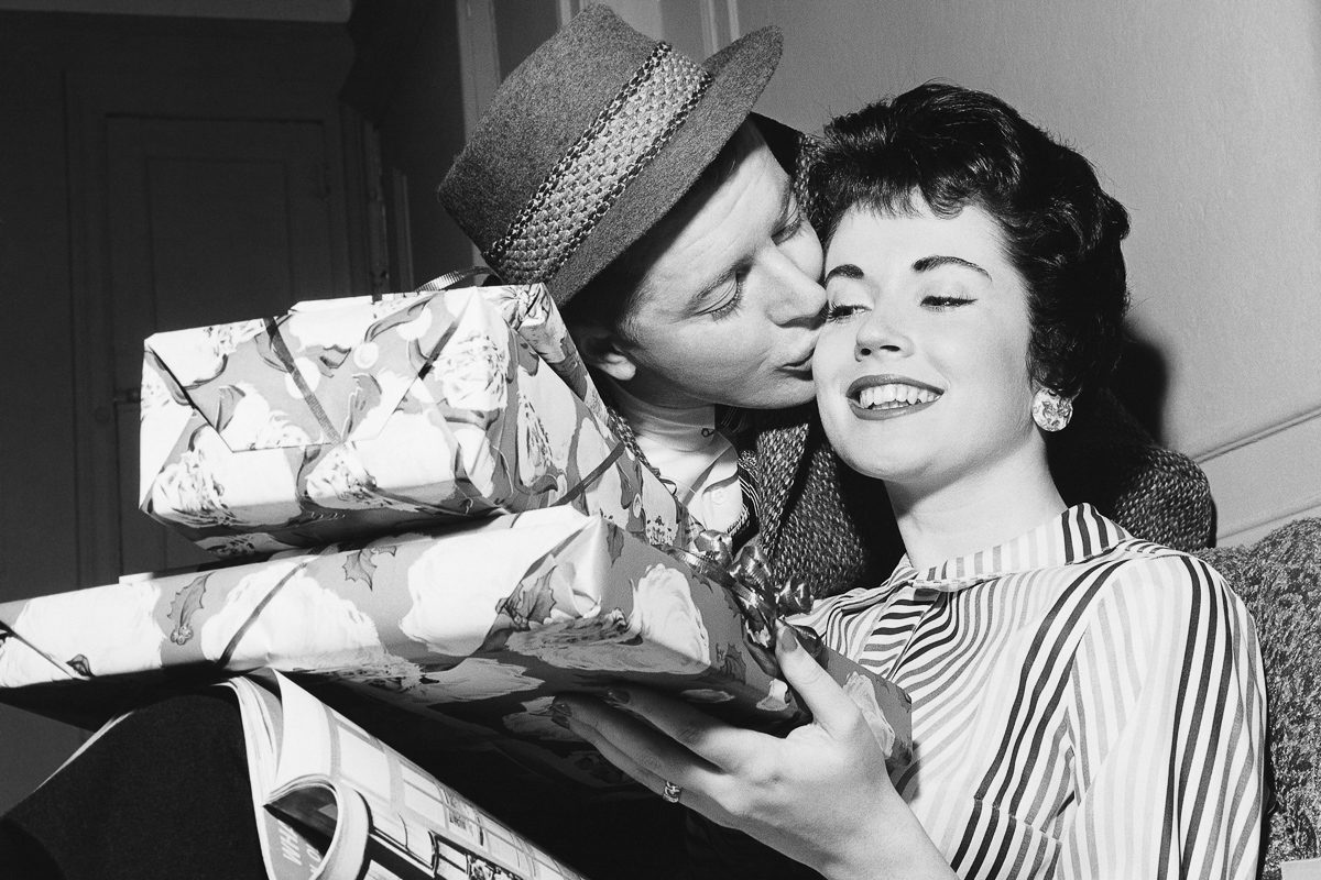 man giving gifts to woman