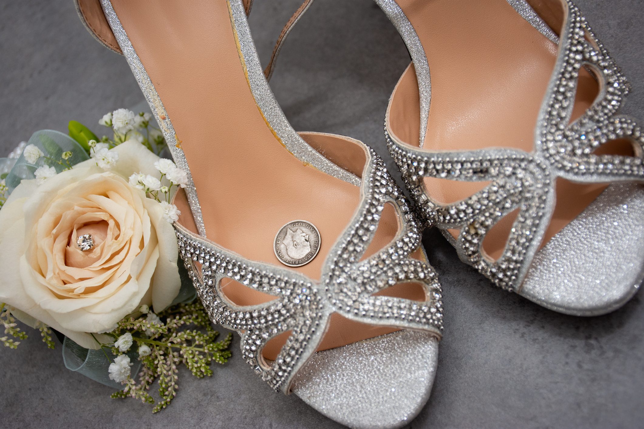Sixpence goodluck charm in wedding shoes