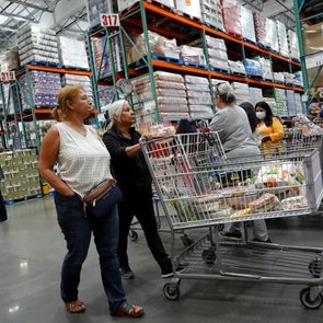 People pushing a grocery cart at Costco