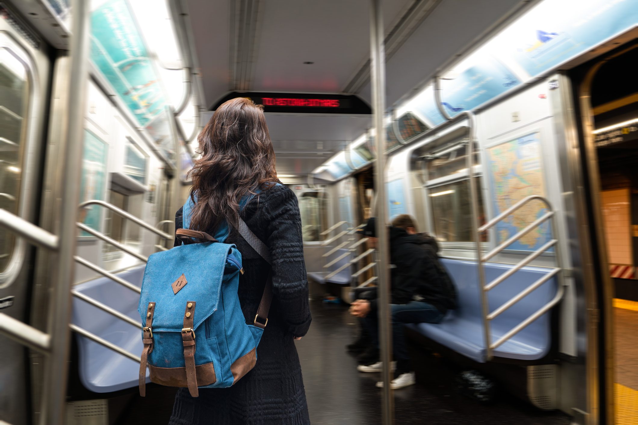 Asian woman traveling with subway in New York.