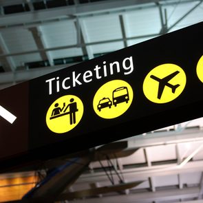 sign guiding people towards ticketing desk