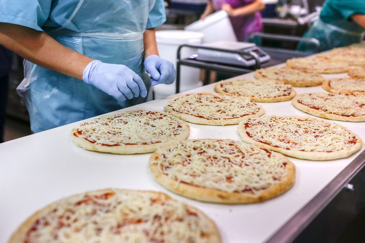 killed Hands of Factory Worker on Pizza Assembly Line