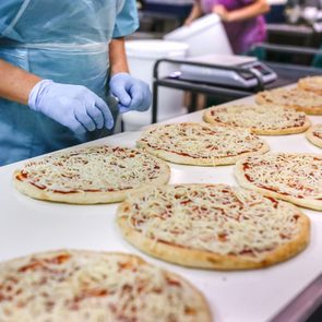killed Hands of Factory Worker on Pizza Assembly Line
