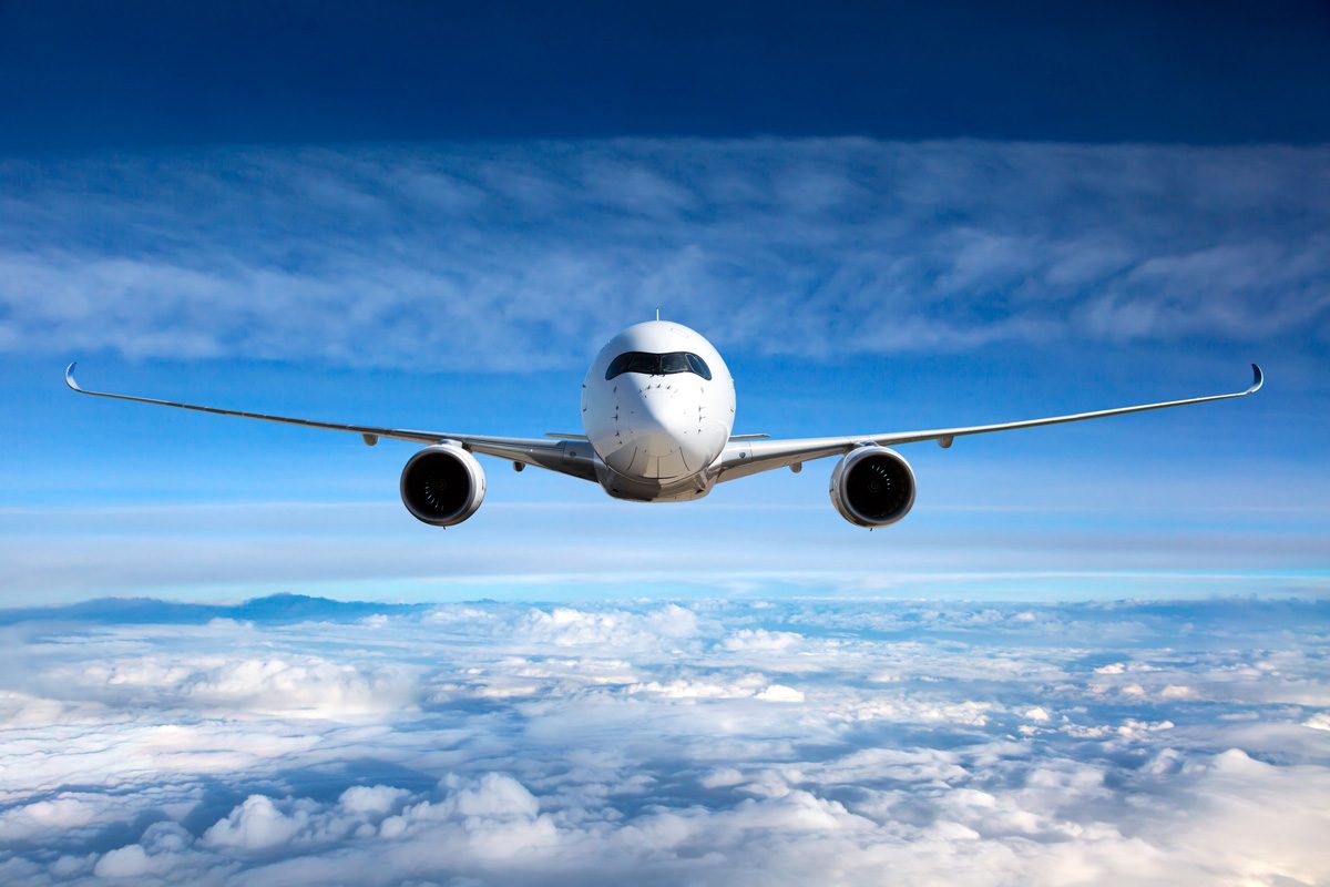 Airplane flying above clouds