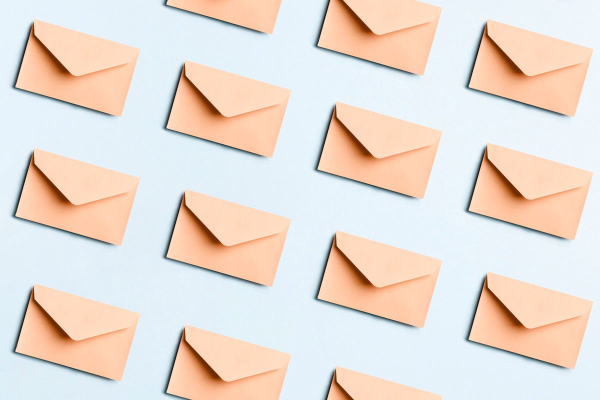 Many Beige Envelopes On Blue Background