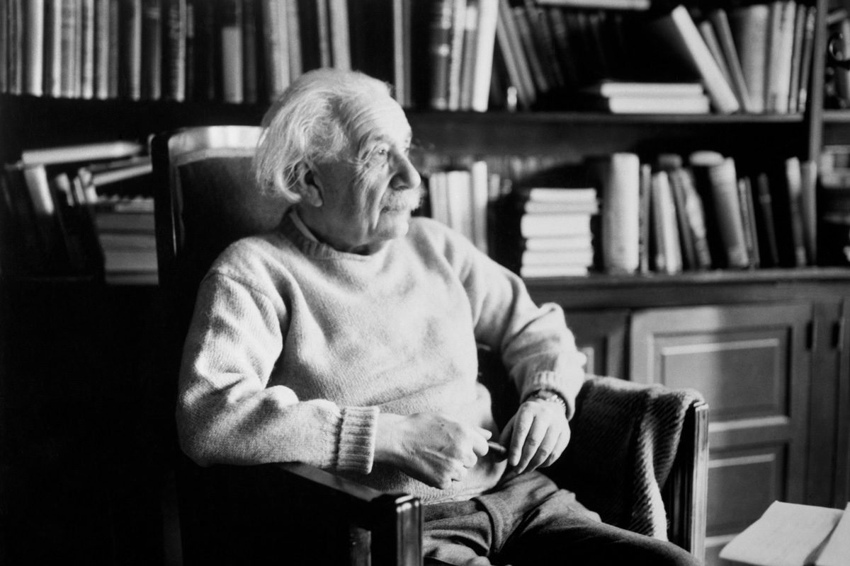 Scientist Albert Einstein in a library