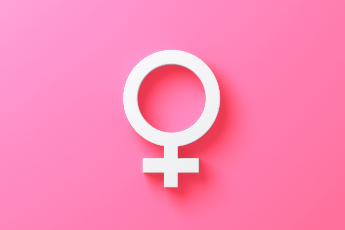 White Female Gender Symbol On Soft Pink Background