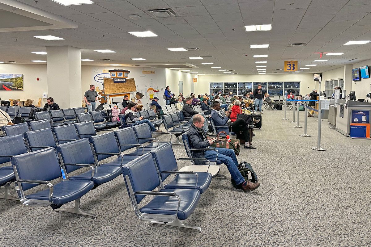 People sitting and waiting in airport terminal