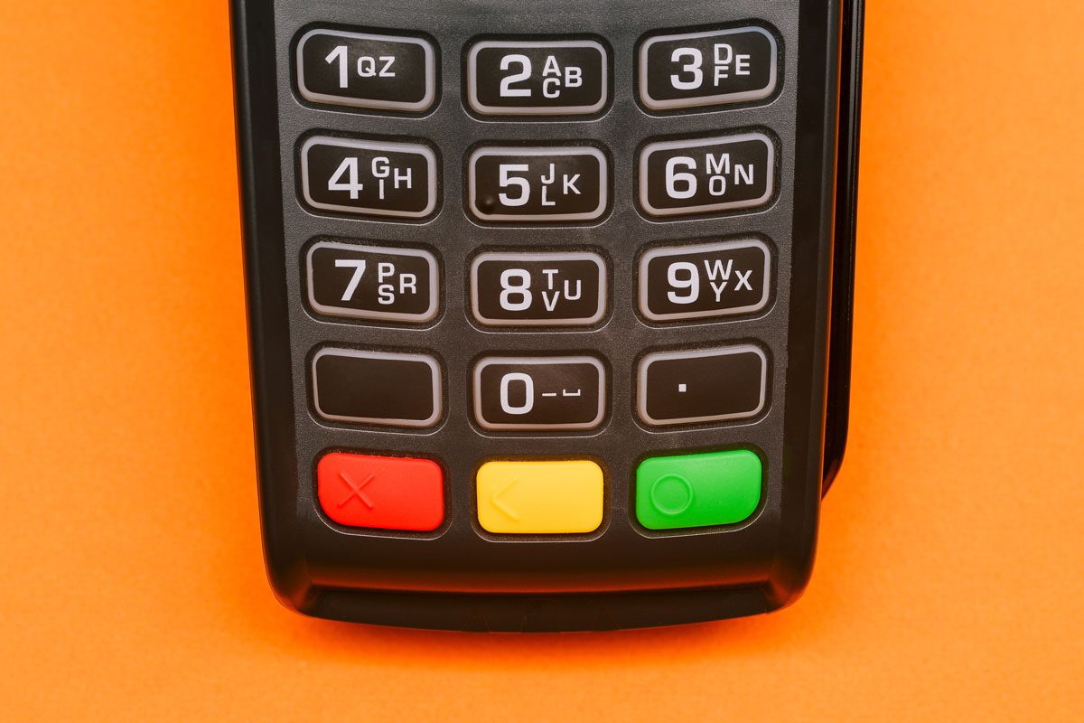 Card Swipe Machine On Orange Background