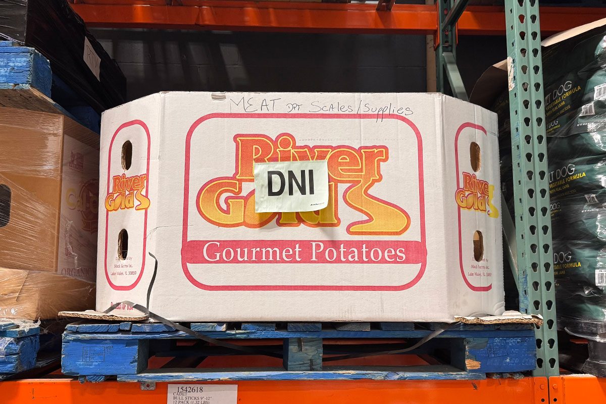 Costco potato box with a "DNI" sticker on it