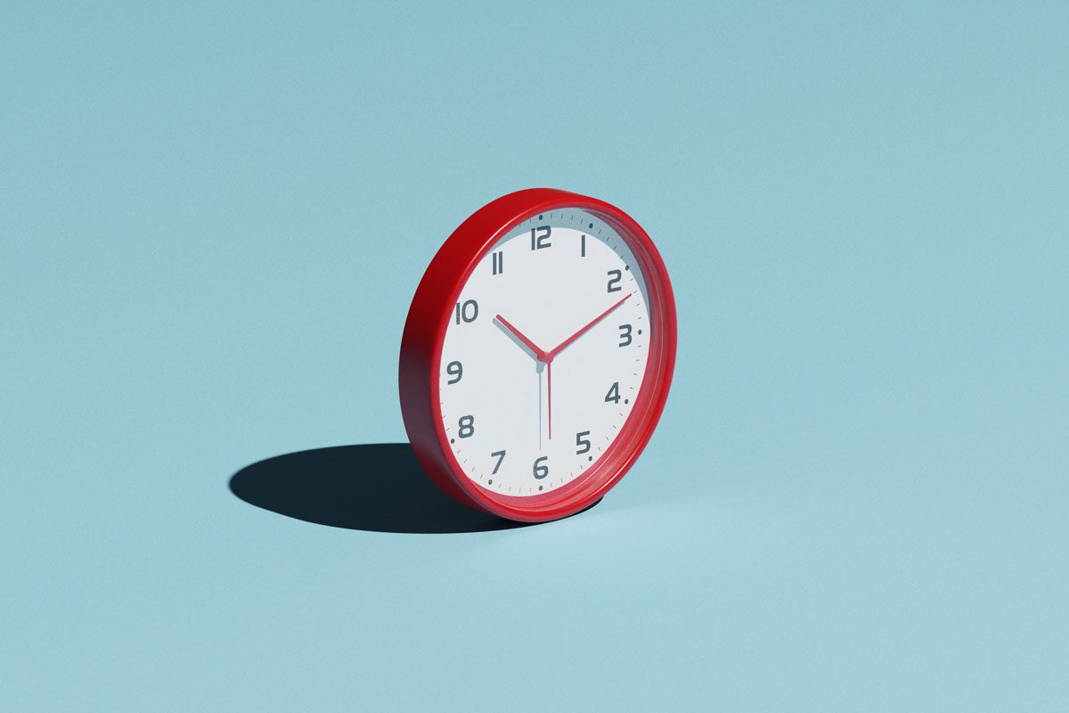 Red Clock With A Hard Shadow On A Cyan Colored Background