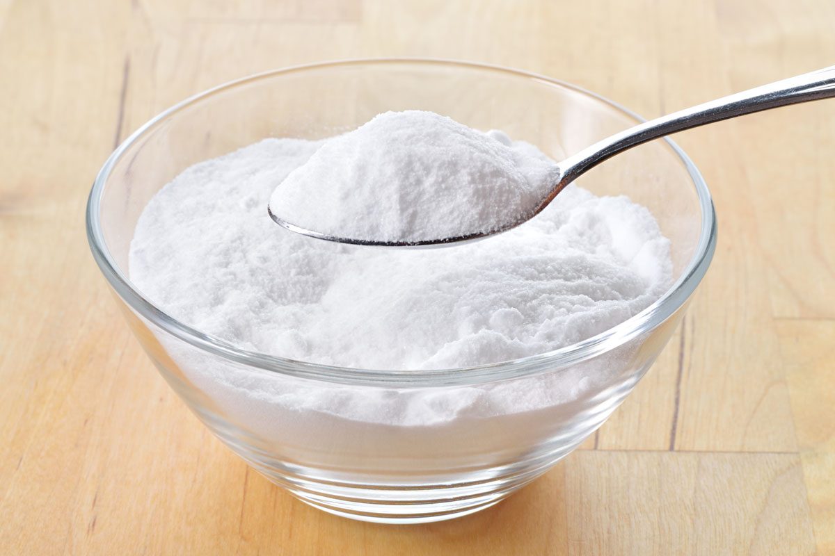 Baking Soda In A Glass Bowl With One Spoon