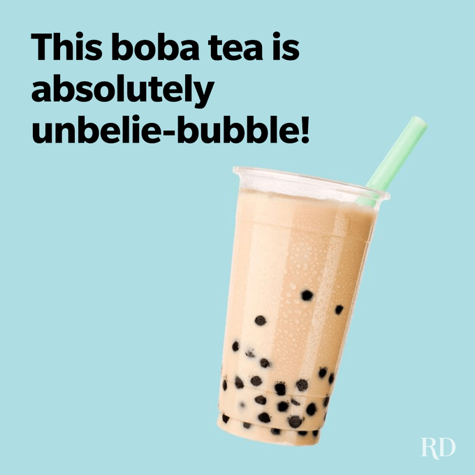 Boba tea sits in a plastic cup with a green straw, against a solid light blue background. Text reads: "This boba tea is unbelie-bubble!"