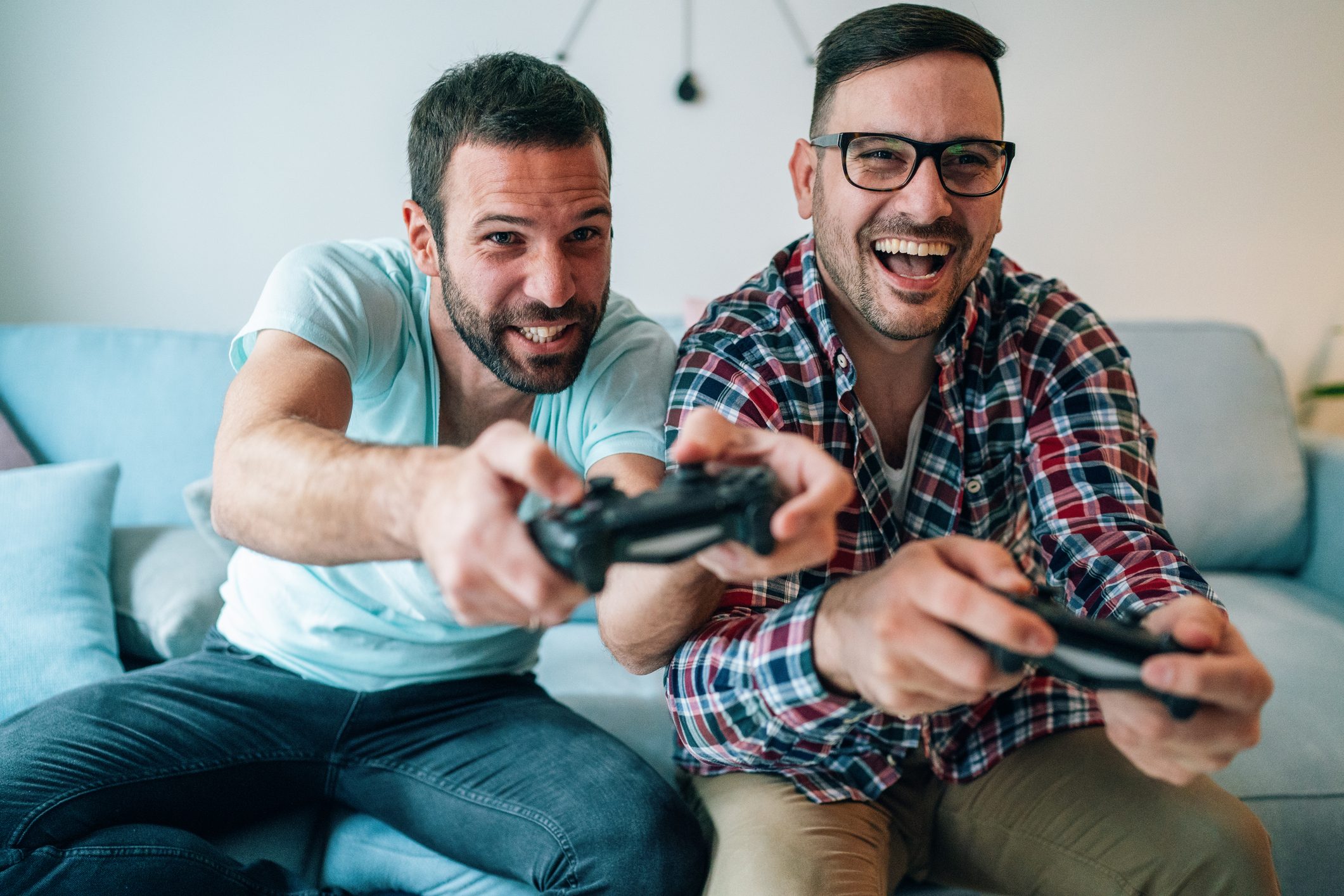 Excited friends playing video games