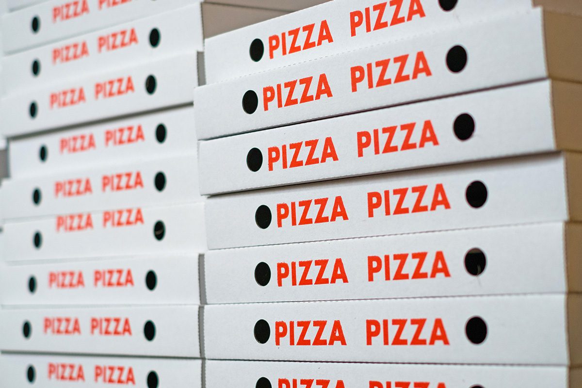 Here's What The Holes In Pizza Boxes Are For Gettyimages 943545360 Ft