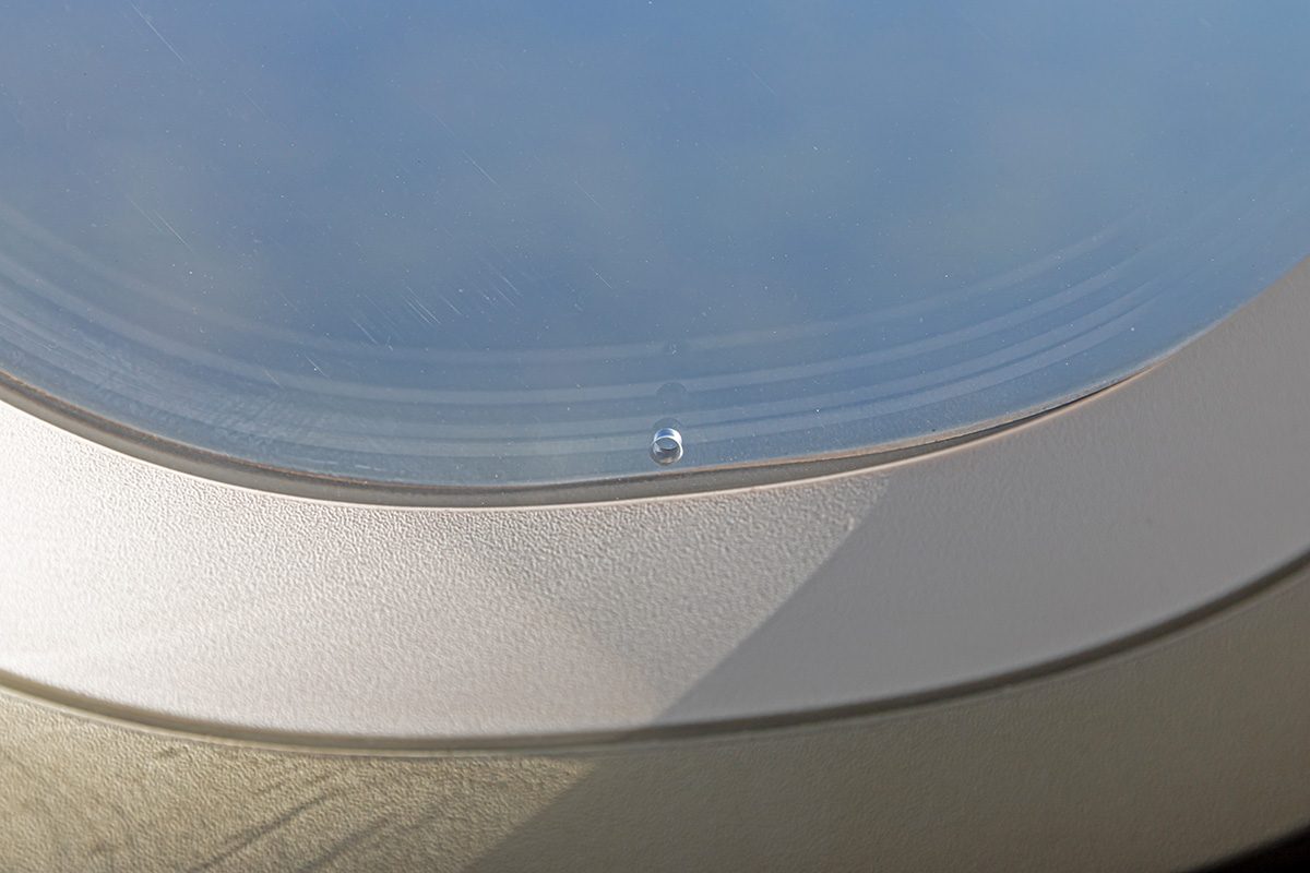 Small hole in airplane window
