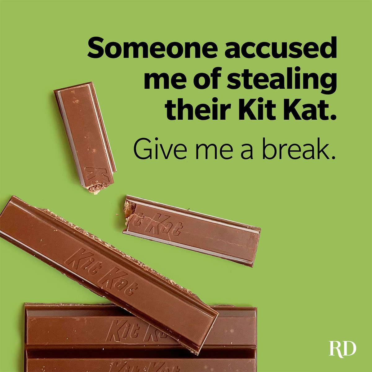 Broken Kit Kat bars rest on a green surface, with text reading, "Someone accused me of stealing their Kit Kat. Give me a break."