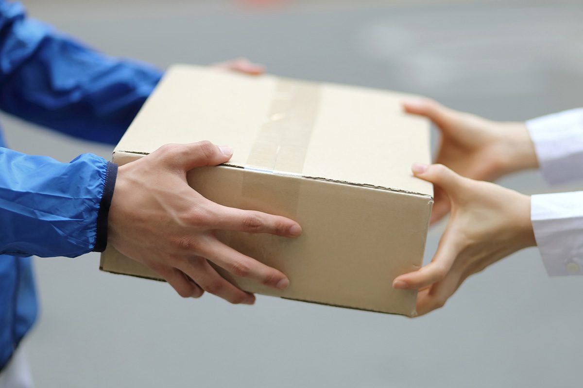 Delivery person with packages,close up