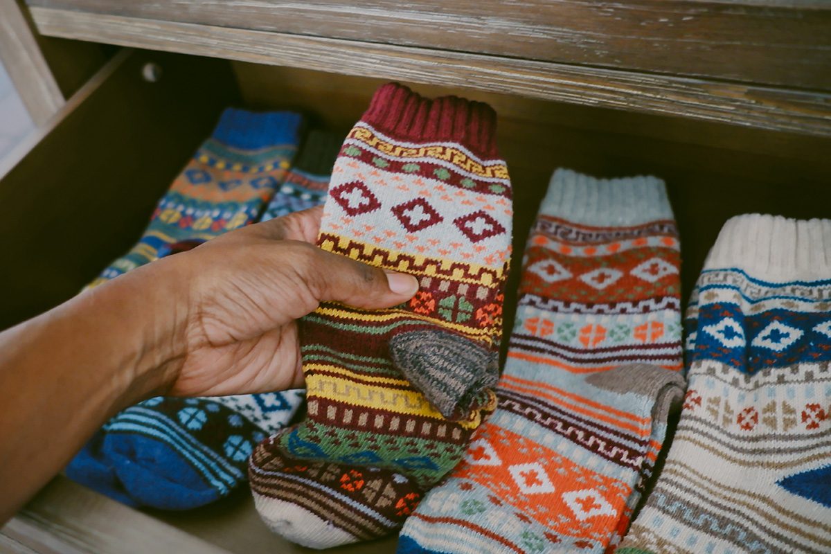 Close-up of a hand holding socks