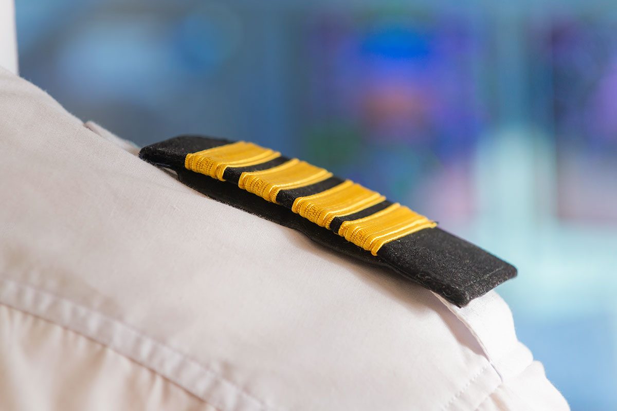 Close up of captain's epaulettes in the cockip of commercial airplane
